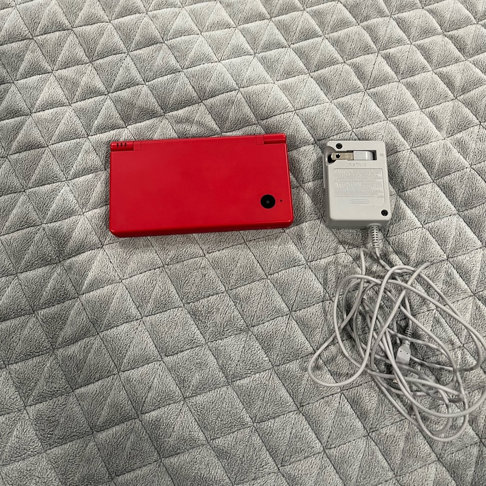 Red Nintendo dsi with charger